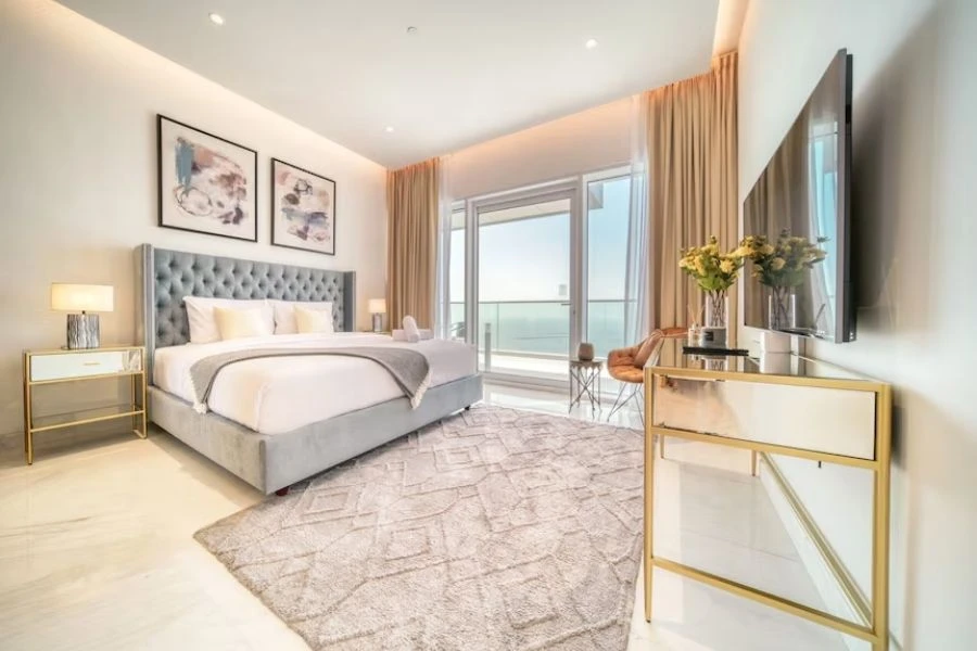 Luxury penthouse bedroom with terrace view.