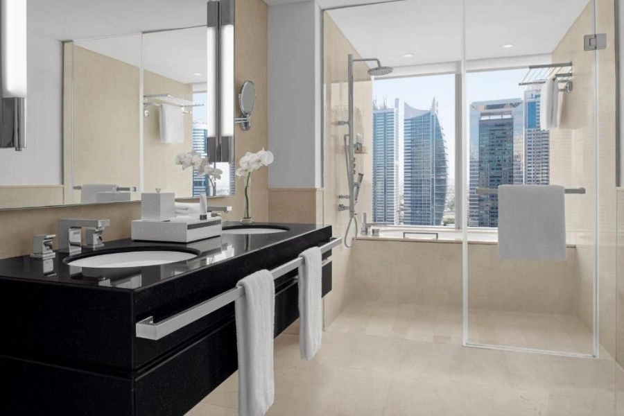 Modern black vanity bathroom renovation in Dubai skyscraper.