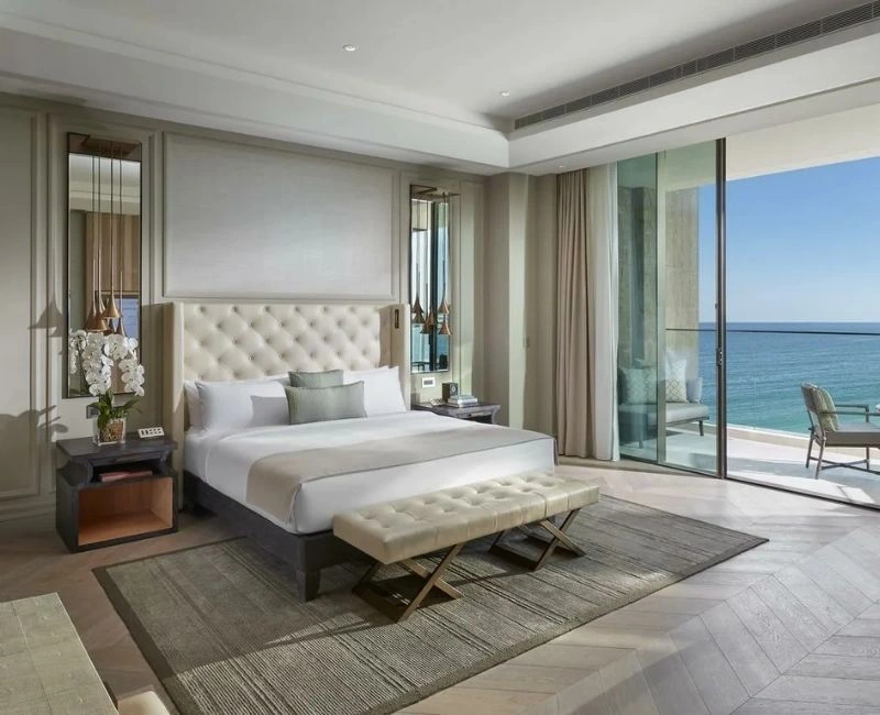 Modern bedroom design with large glass window.