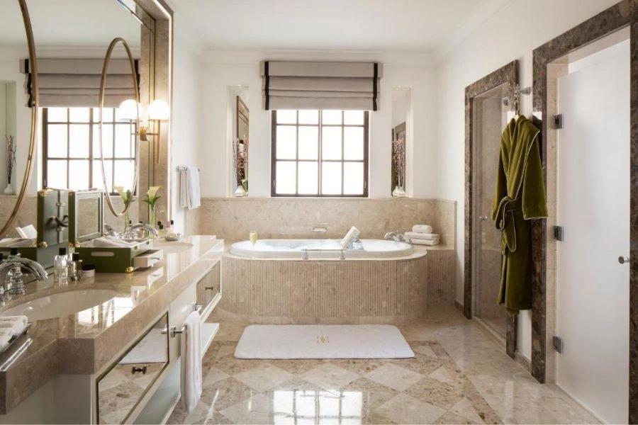 Classic luxury bathroom renovation with marble bathtub.
