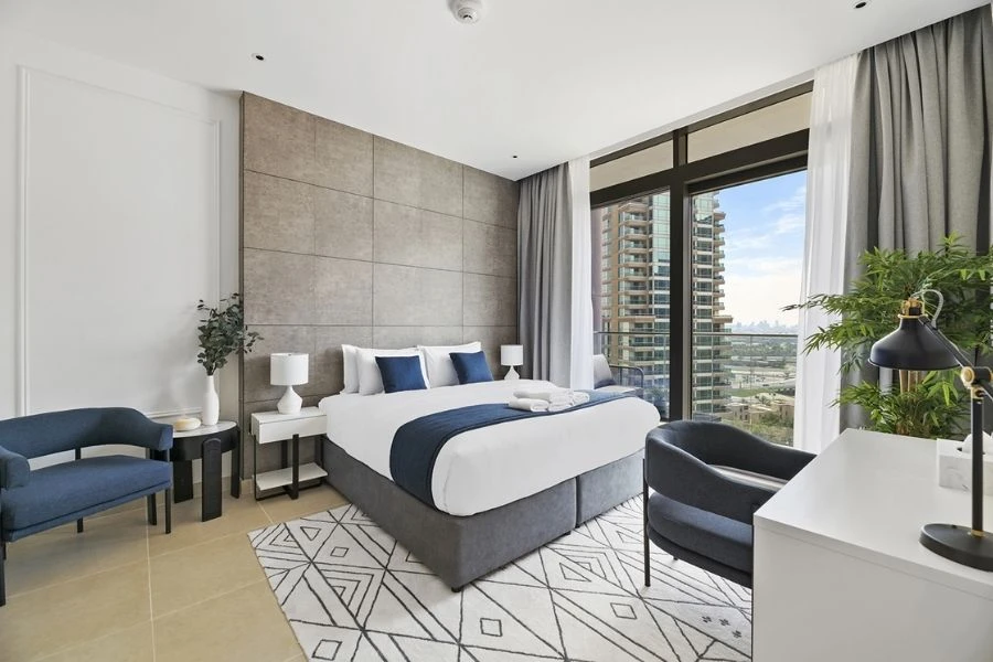 Bedroom renovation with wooden chevron floor.