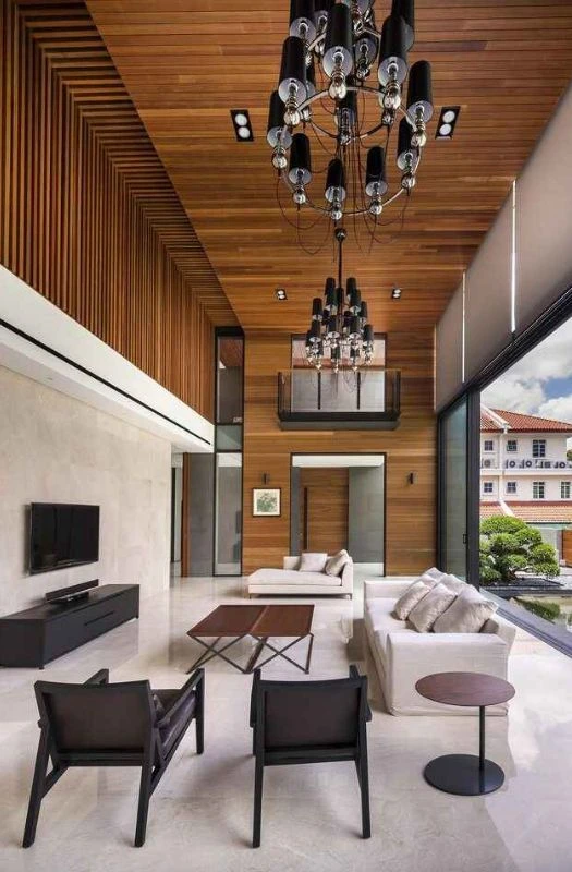 Wood paneling in modern high ceiling apartment renovation Dubai.