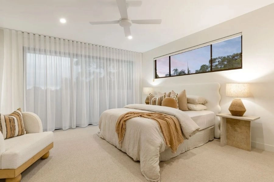 Minimalist white sheer curtains for bedroom windows.