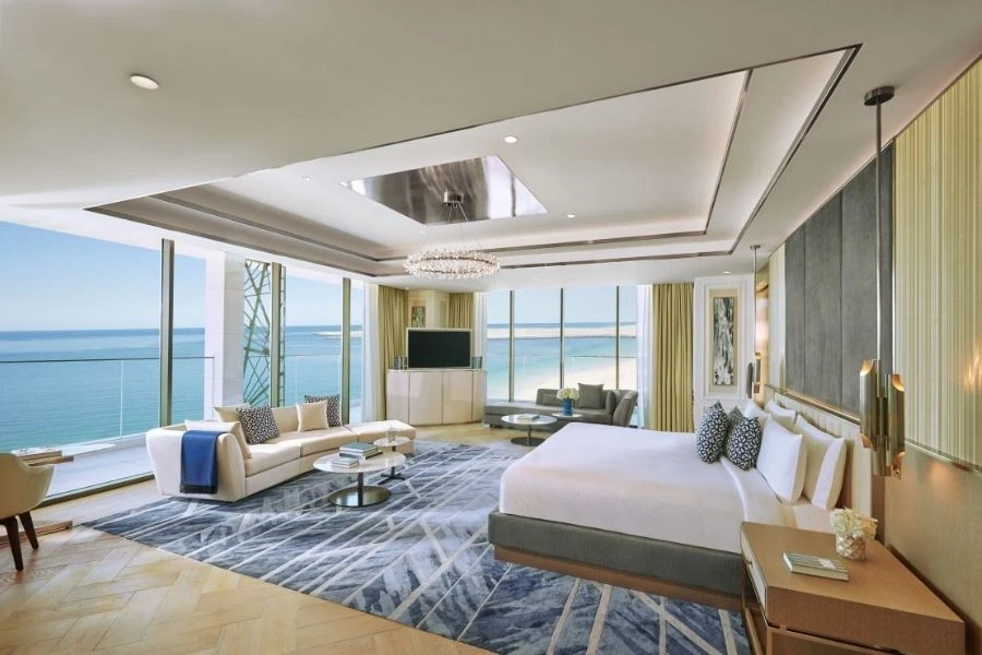 Modern bedroom design with large glass window.