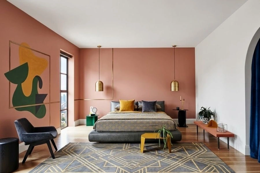Modern bedroom with peach and white wall paint.