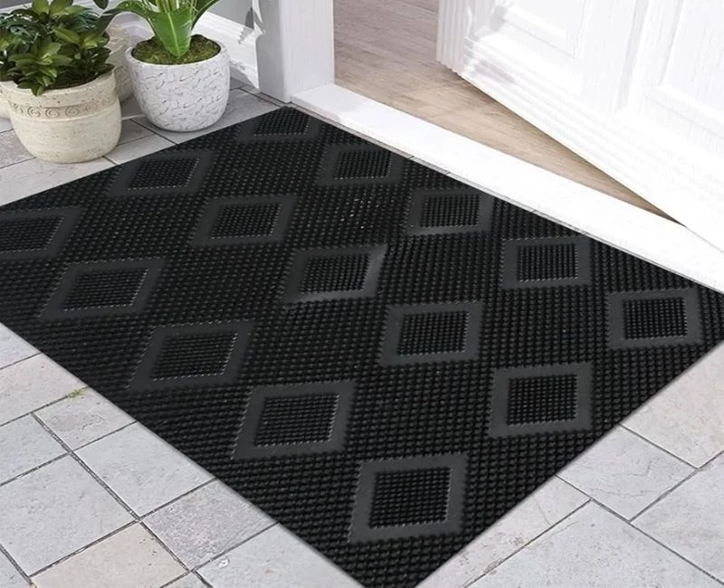 Black rubber door mat with diamond pattern design.