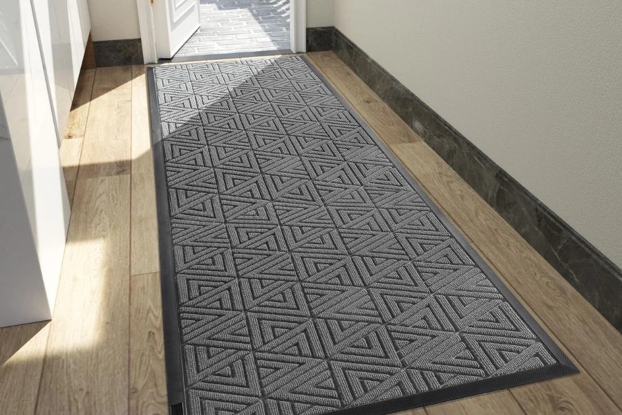 Grey geometric patterned runner floor mat in hallway.