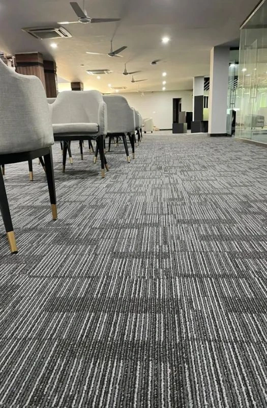 Durable grey linear pattern carpet tiles in Dubai.