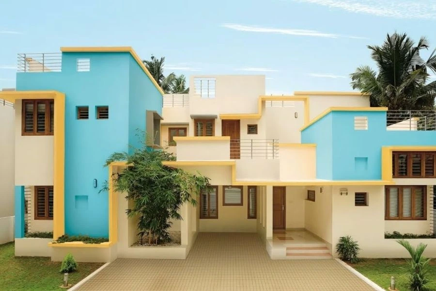 Modern house exterior with fresh blue and cream paint.