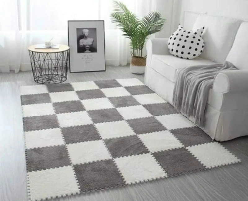 Grey and white checkered interlocking plush floor mat.
