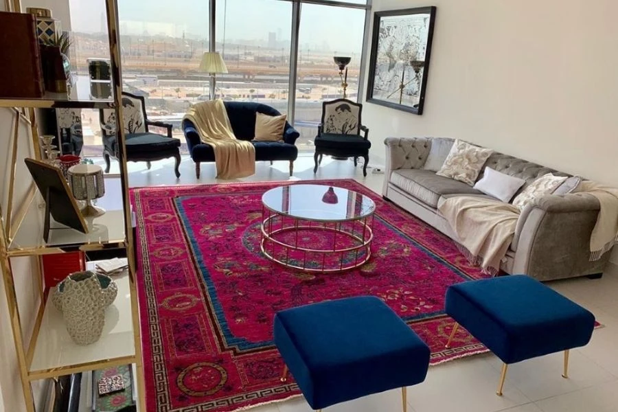 Vibrant pink Persian style rug in luxury living room.