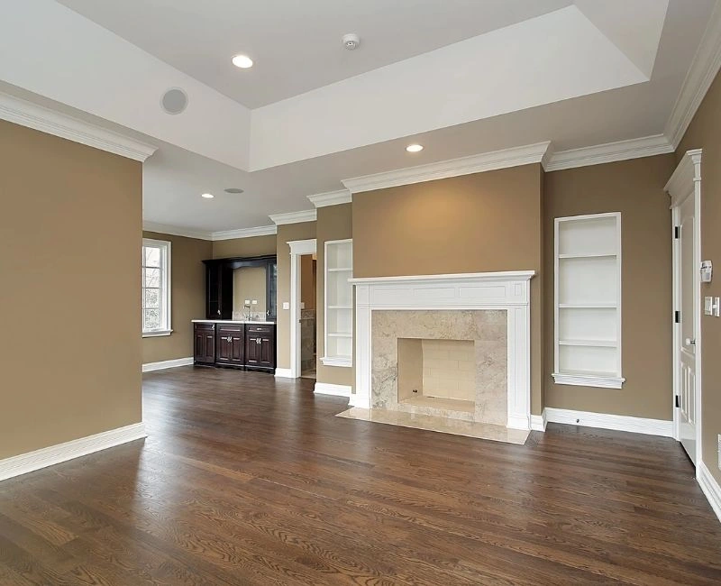Modern living room with beige walls and white ceiling trim.