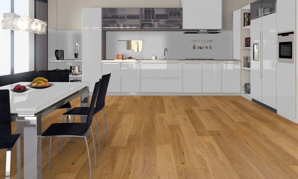 Modern white kitchen with wooden flooring