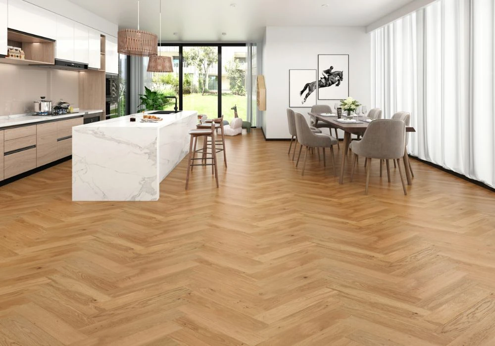 Open kitchen with light oak herringbone flooring