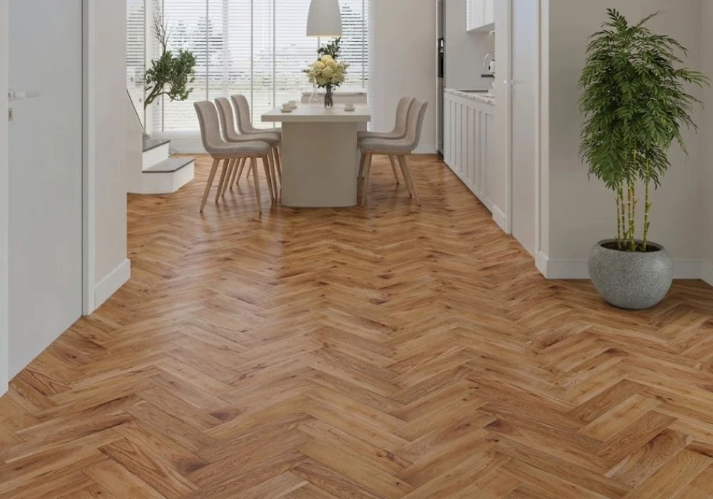 Open dining space with teak herringbone parquet