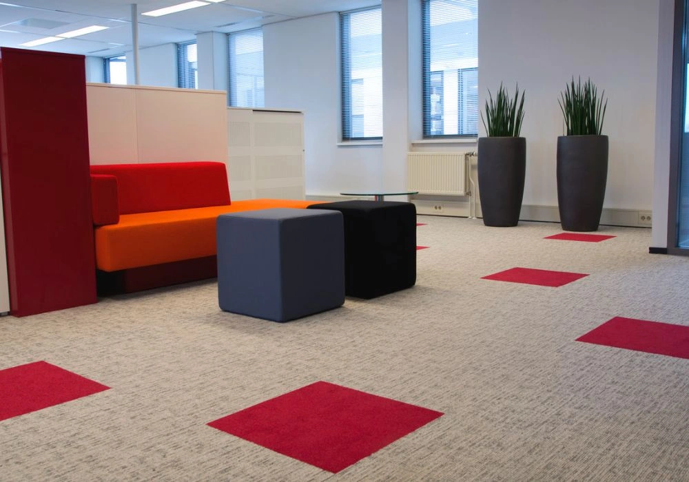 Light grey carpet tiles with red accents