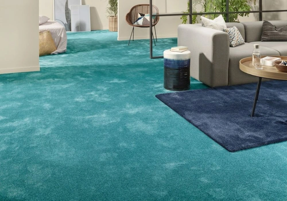 Teal blue wall to wall carpet living room