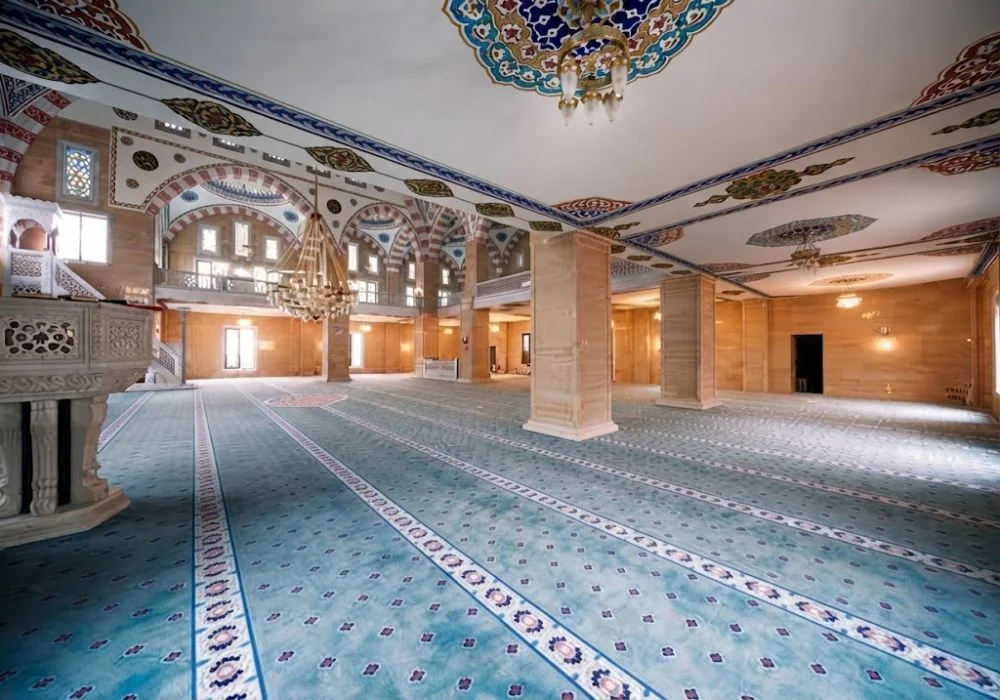 Light blue mosque carpet in traditional interior hall