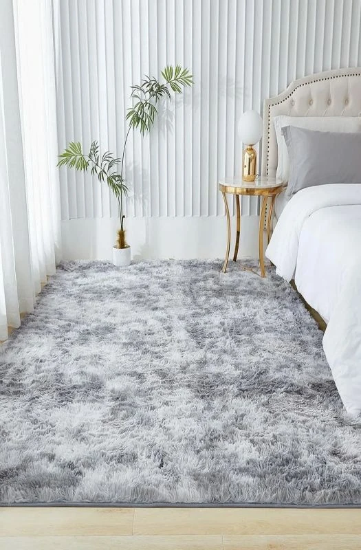 Grey fluffy shaggy rug in Dubai bedroom.