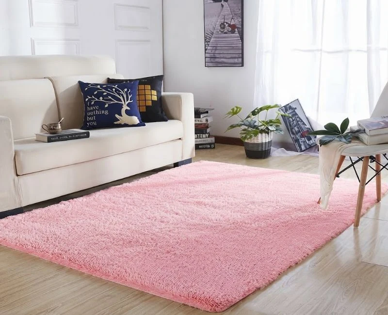 Soft pink fluffy shaggy rug in Dubai bedroom.
