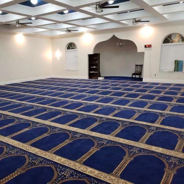Blue dome patterned mosque carpet in prayer hall