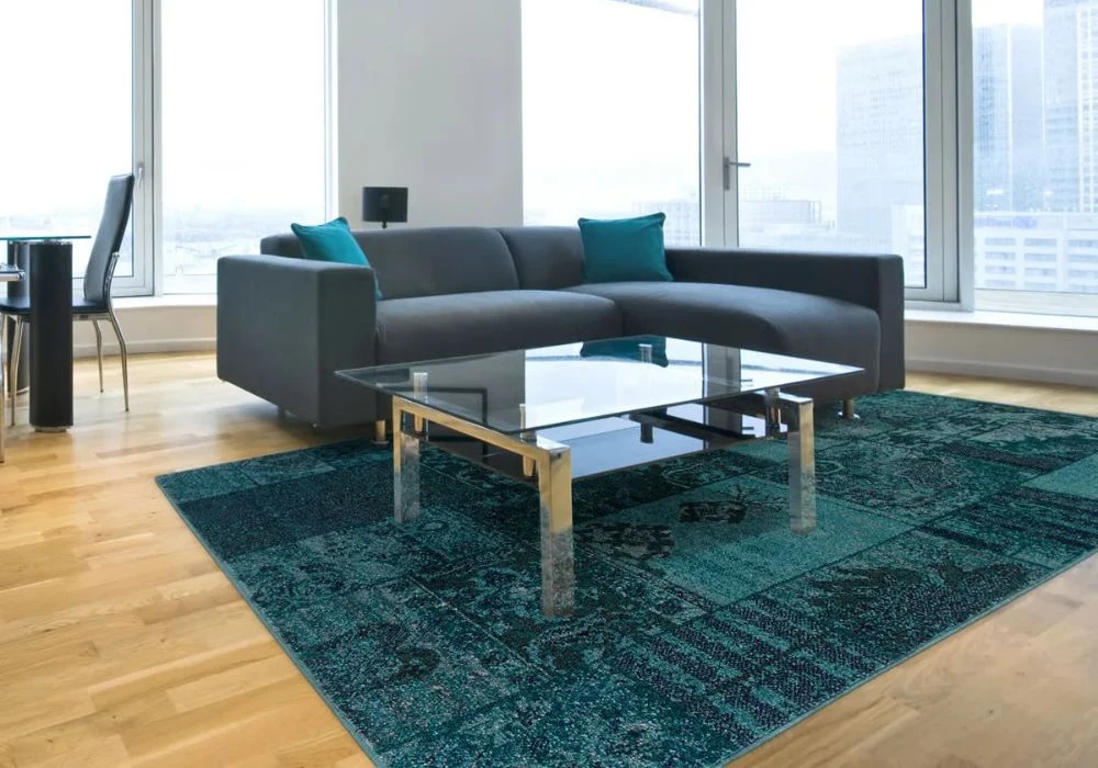 Teal blue patchwork design area rug