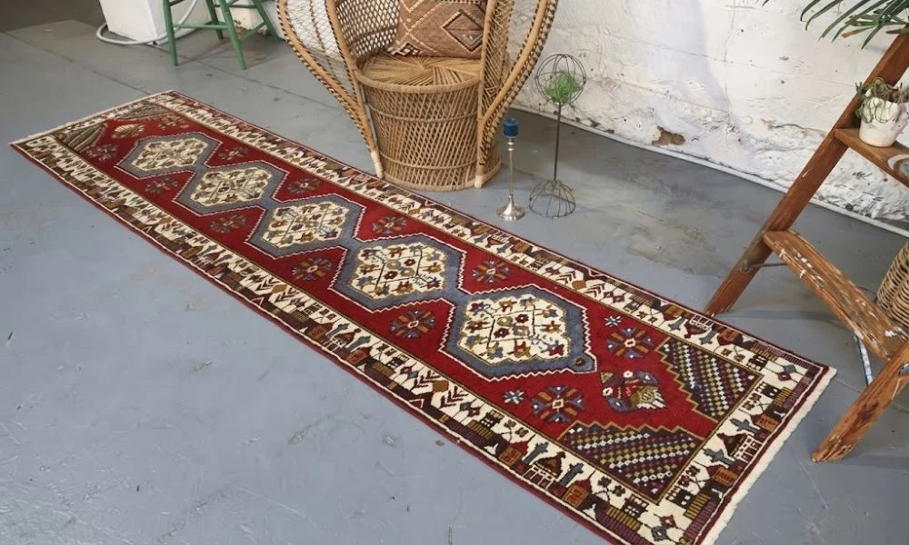 Red vintage Persian runner rug in UAE
